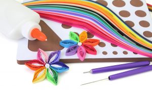 Basic quilling tools and quilling paper